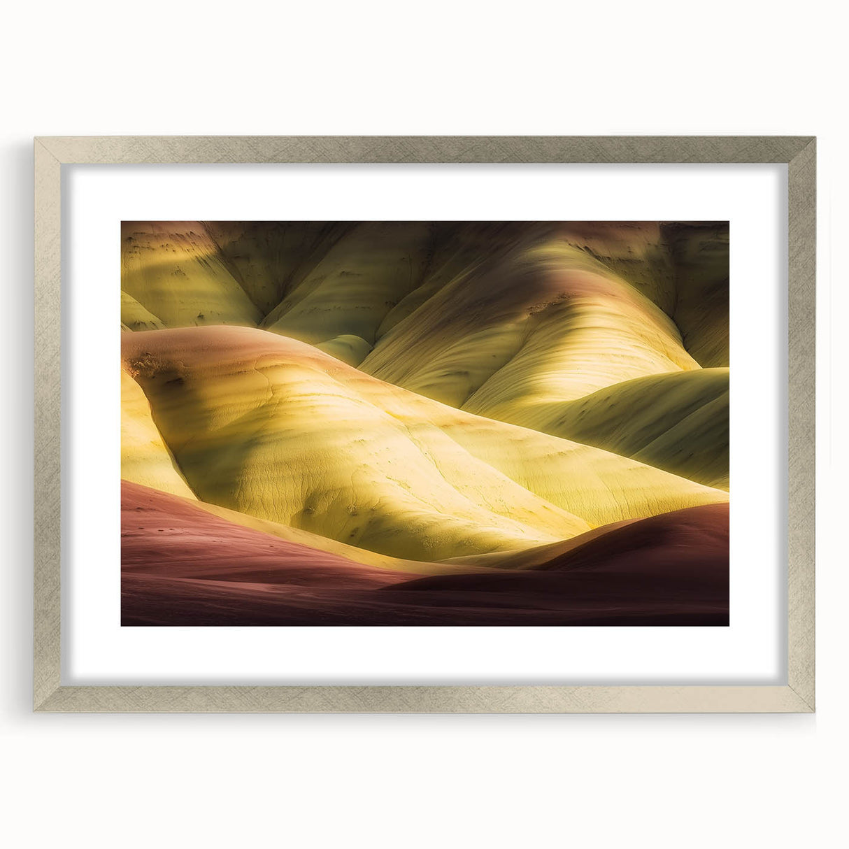 Landscape art print featuring canyons in a silver frame with a white mat, showcasing vibrant colors and intricate details, perfect for enhancing home decor.