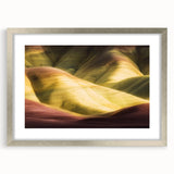 Landscape art print featuring canyons in a silver frame with a white mat, showcasing vibrant colors and intricate details, perfect for enhancing home decor.