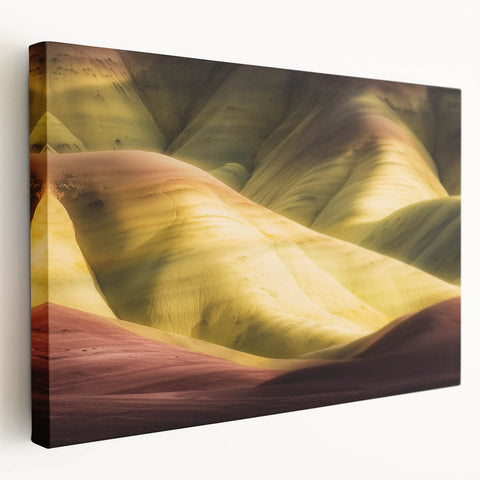 Stretched canvas art depicting a stunning landscape of colorful canyons, showcasing vibrant hues of orange and purple under a clear blue sky, perfect for home decor.