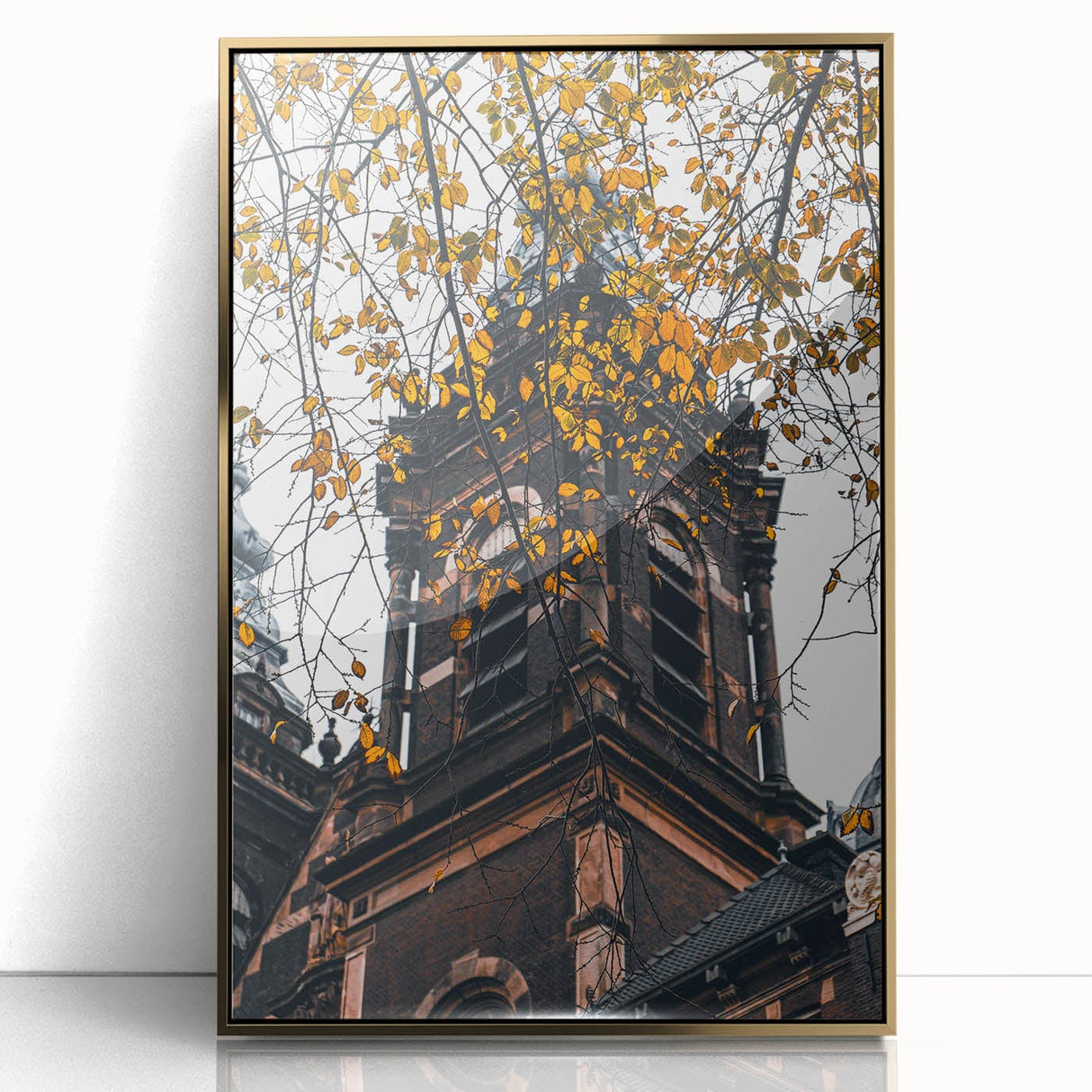 Large art print of a mid-century modernist autumn scene in gold and orange tones on a framed acrylic.
