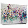 Abstract acrylic glass artwork displaying vibrant splatters in an array of colors, showcased from a side view with decorative pins, perfect for modern home decor.