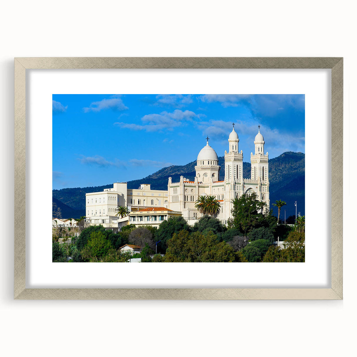 Abstract art print depicting Algerian scenery in muted earth tones, framed in silver, ideal for dining room decor.