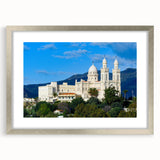 Abstract art print depicting Algerian scenery in muted earth tones, framed in silver, ideal for dining room decor.
