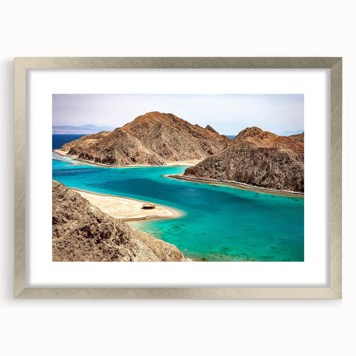 Abstract art print of an Egyptian landscape in muted earth tones, framed in silver, ideal for dining room decor.