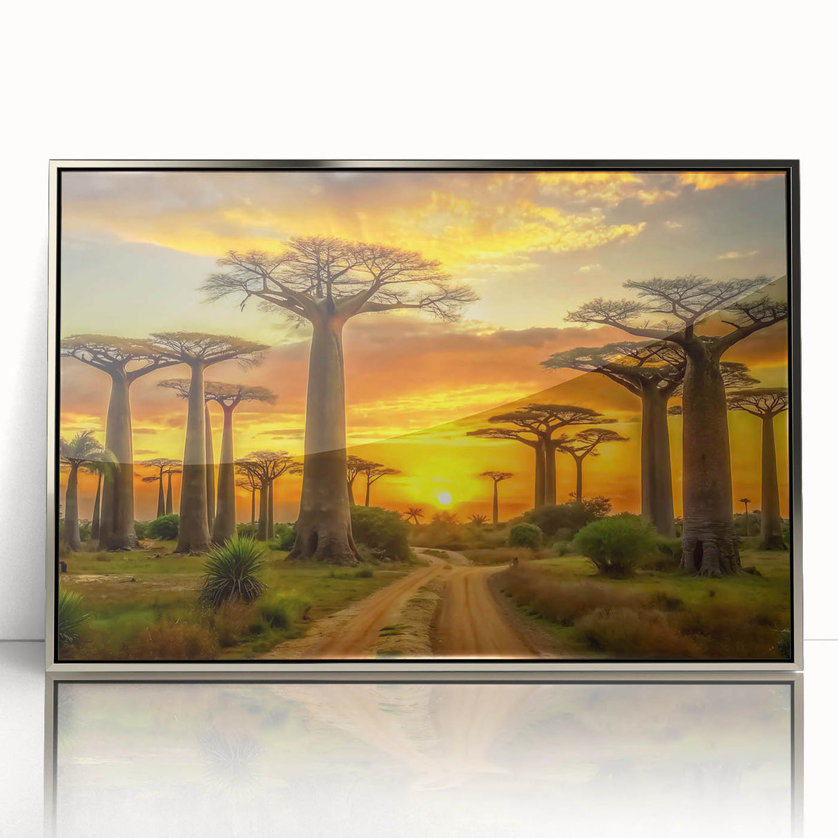 Art deco poster of African scenery with silver frame on acrylic, displaying muted earth tones.