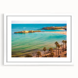 Textured abstract art print depicting a Tunisian landscape in earthy tones, framed in white, suitable for bedroom decor.