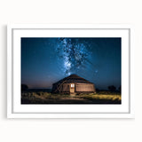 Abstract art print depicting a serene Mongolian landscape in muted earth tones, framed with a white mat.
