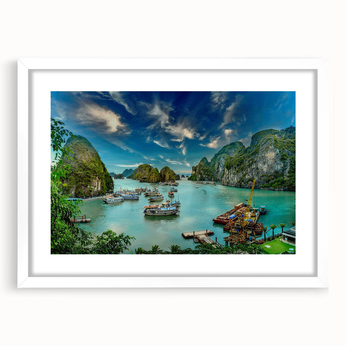 Abstract art print of a Vietnamese landscape in muted green and blue tones on a framed white mat.