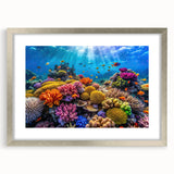 Abstract art print of the Great Barrier Reef in pastel blue and green tones, framed in silver, ideal for dining room decor.