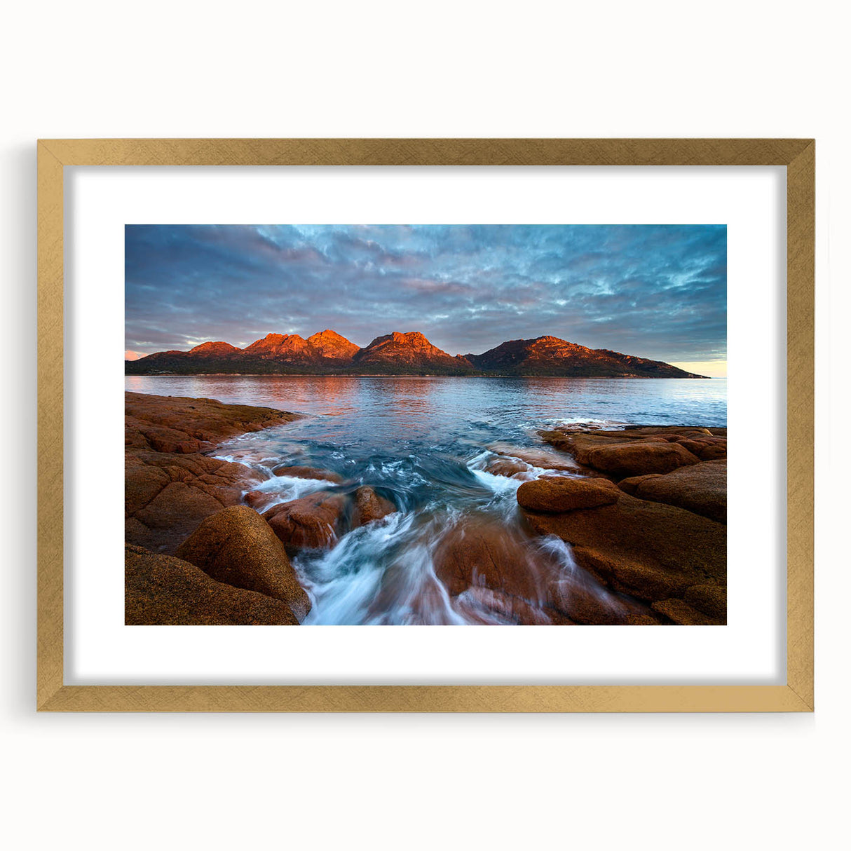 Abstract art print of Tasmania's landscape in muted earth tones on a framed canvas.