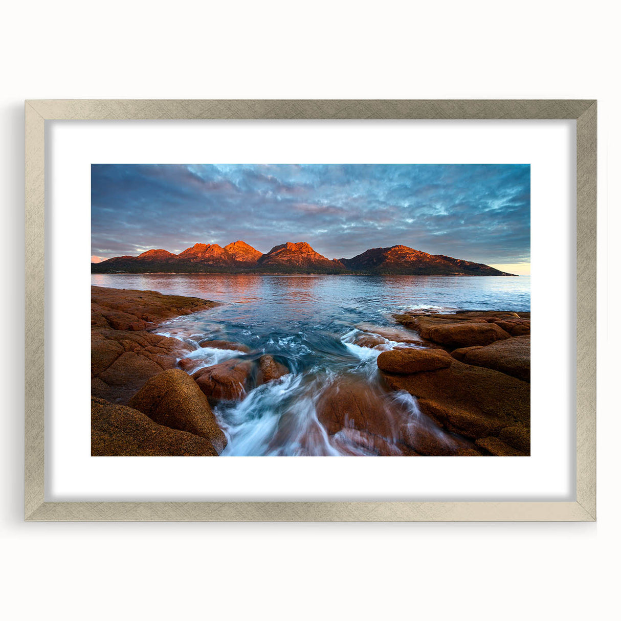 Extra large textured abstract art print depicting a serene Tasmanian landscape in muted earth tones, framed in silver.