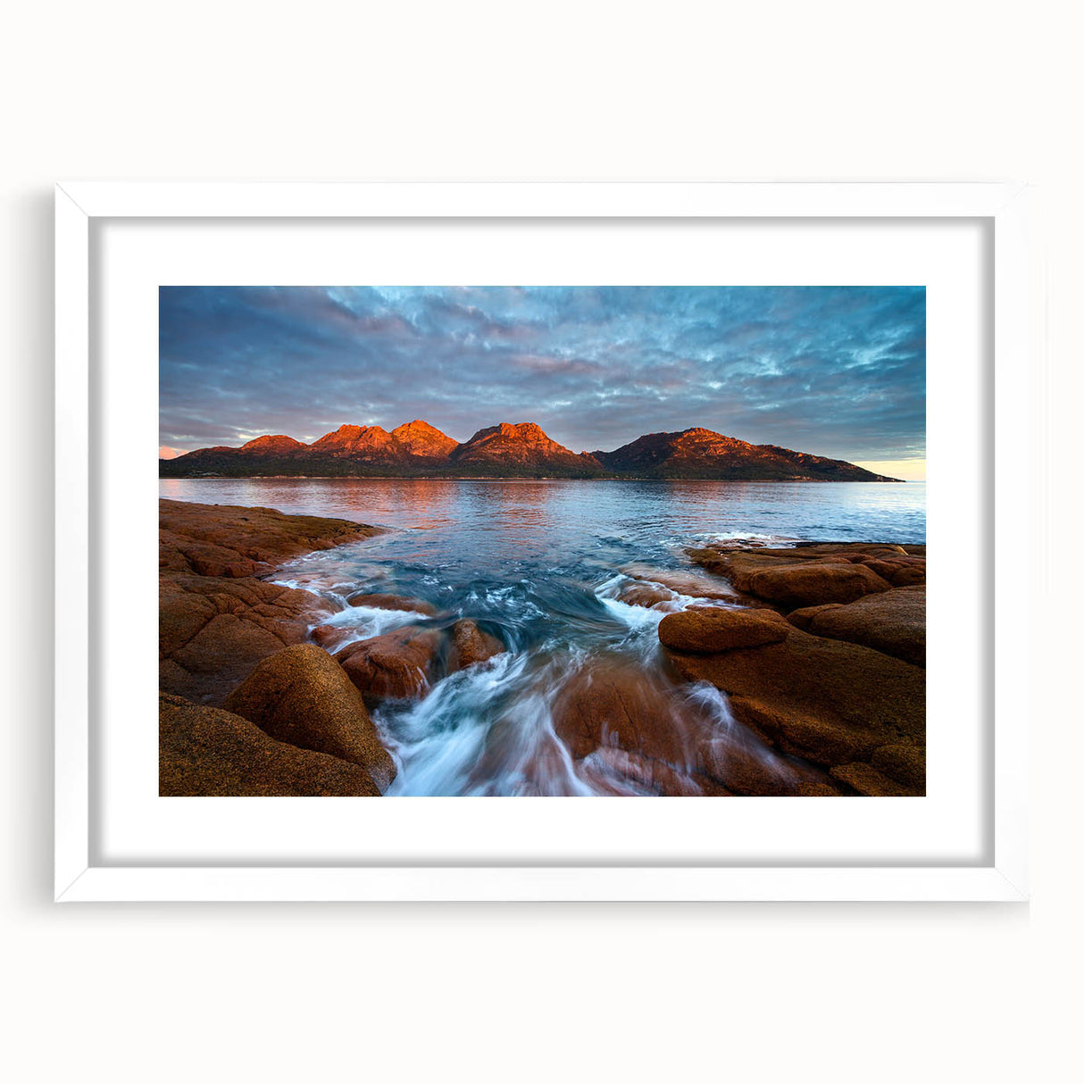 Textured art depicting abstract scenery of Tasmania in muted earth tones, framed in white, ideal for bedroom decor.