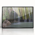 Large abstract wall art depicting a Caribbean landscape in muted blue and green tones, framed in black acrylic.