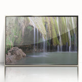 Art deco poster of a Caribbean scene with vibrant blue and green tones on a silver-framed acrylic.
