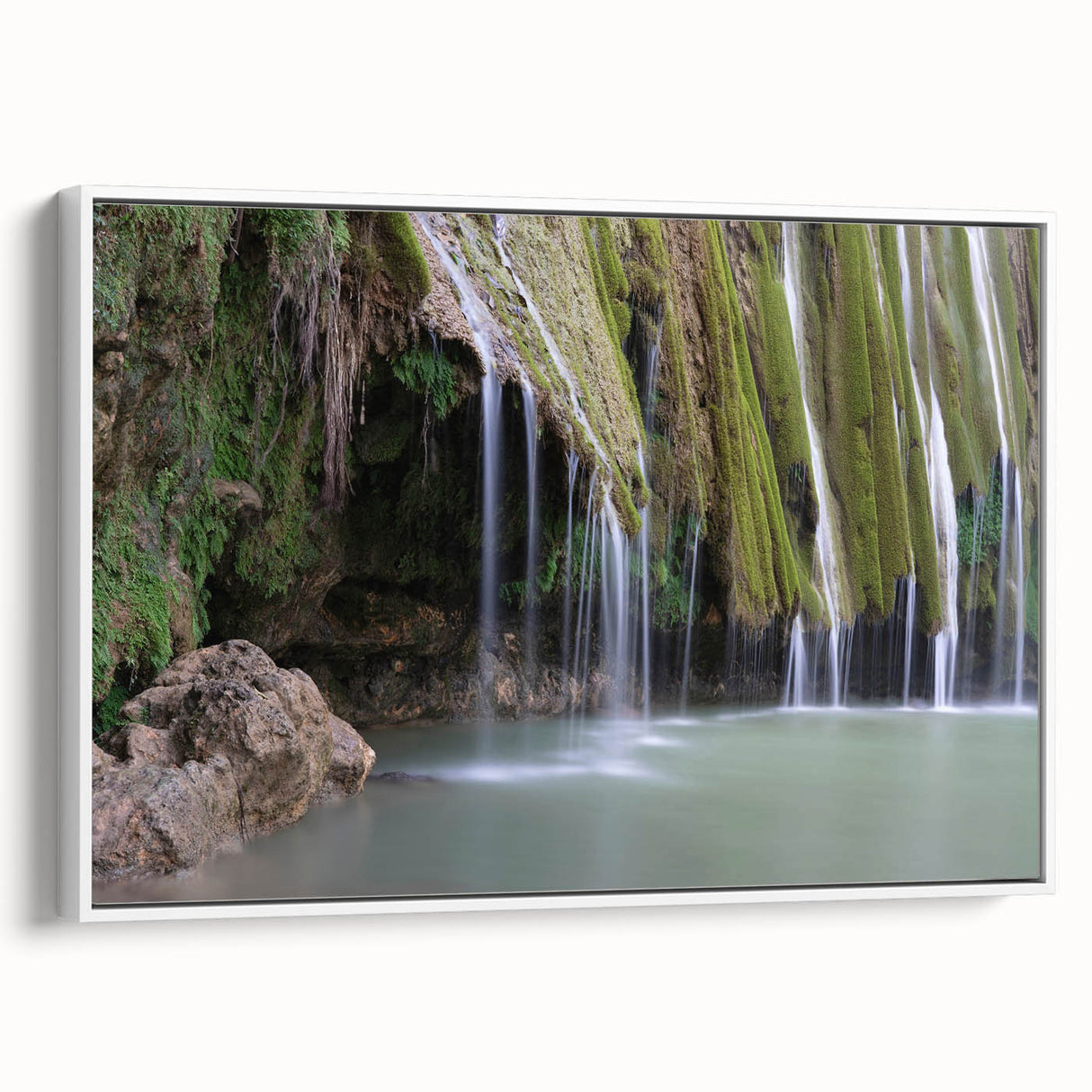Framed canvas depicting a Caribbean landscape with vibrant greenery and ocean views, suitable for living room decor.
