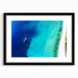 Abstract art print of vibrant Caribbean scenery on textured canvas, framed in black, ideal for living room decor.