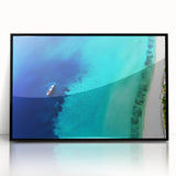 Large abstract wall art depicting Caribbean scenery, in muted blue and green tones, framed in black acrylic.