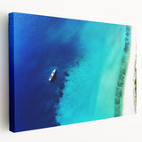 Stretched canvas print of a Caribbean beach with vivid blue and turquoise waters, ideal for kitchen wall art.