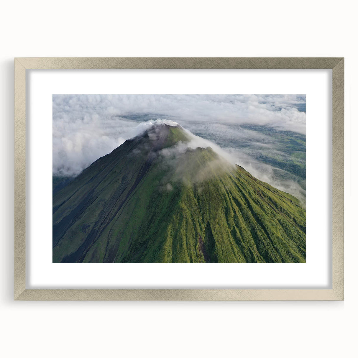 Textured abstract art print of a Central American landscape in muted earth tones on a framed silver mat.