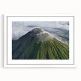 Abstract art print depicting a lush Costa Rican landscape in vibrant green and blue tones, framed with a white mat.