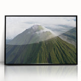 Large abstract wall art depicting a stylized Costa Rican landscape in muted earth tones, framed in black acrylic.
