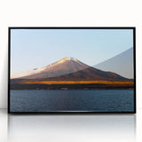 Large abstract wall art of a Central American landscape in muted earth tones, framed in black acrylic.