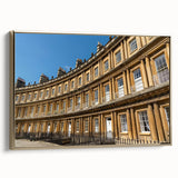 Framed canvas of a vintage landscape painting depicting the Bath, England skyline in black and gold tones.