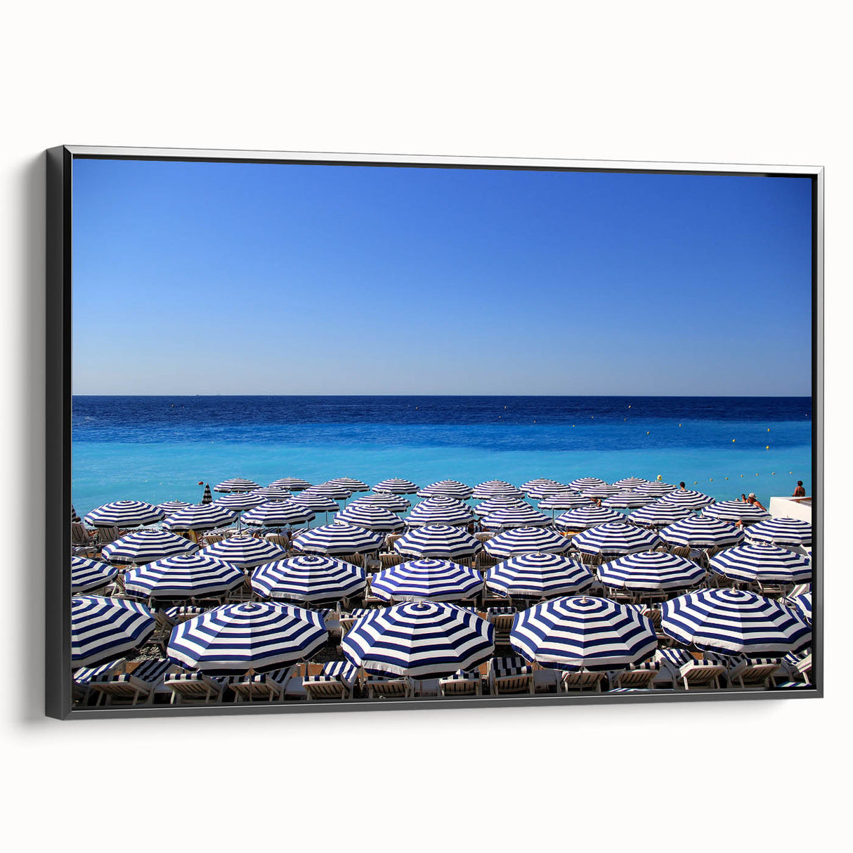 Black and white framed canvas featuring a vintage landscape painting of Nice, France, ideal for bedroom decor.