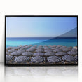 Large abstract wall art depicting a European scenery in muted earth tones, framed in black acrylic.