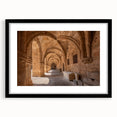 Colorful abstract art print of a European scenery, textured finish on a large black-framed canvas.