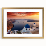 Abstract art print of Santorini with blue and white hues on a gold-framed mat, ideal for dining room decor.