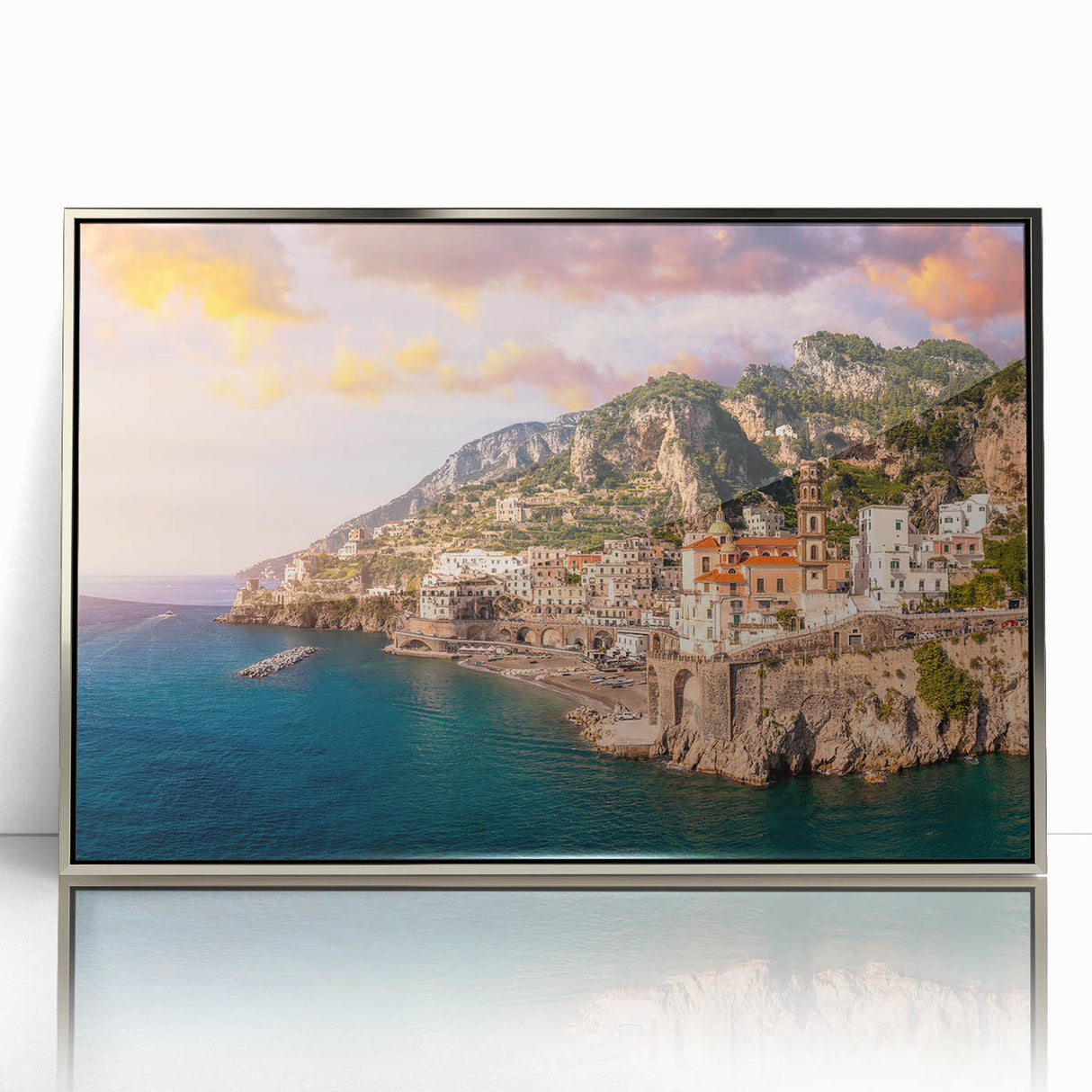 Large art print of Amalfi Coast with vivid blue and white tones, framed in silver acrylic.