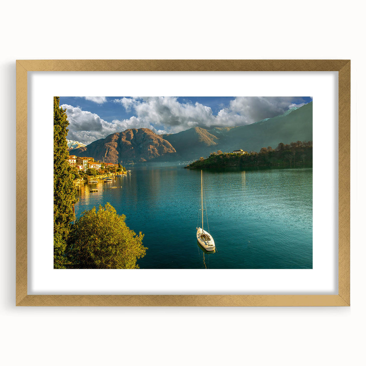 Abstract art print of Lake Como with muted blue and green tones, framed in gold, ideal for dining room decor.