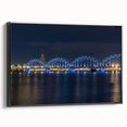 Black and white wall art featuring a vintage poster-style landscape of Latvia on a framed canvas, ideal for bedroom decor.