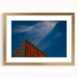 Abstract art print featuring a European Lithuanian landscape in muted gold and green tones, framed with a gold mat.