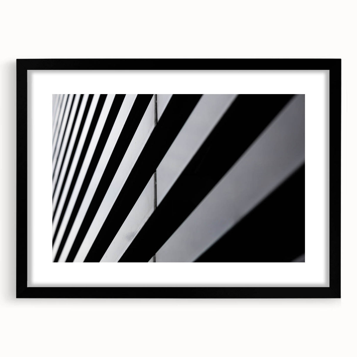 Colorful abstract art print of Amsterdam scenery in vibrant hues on a large textured canvas, framed in black.