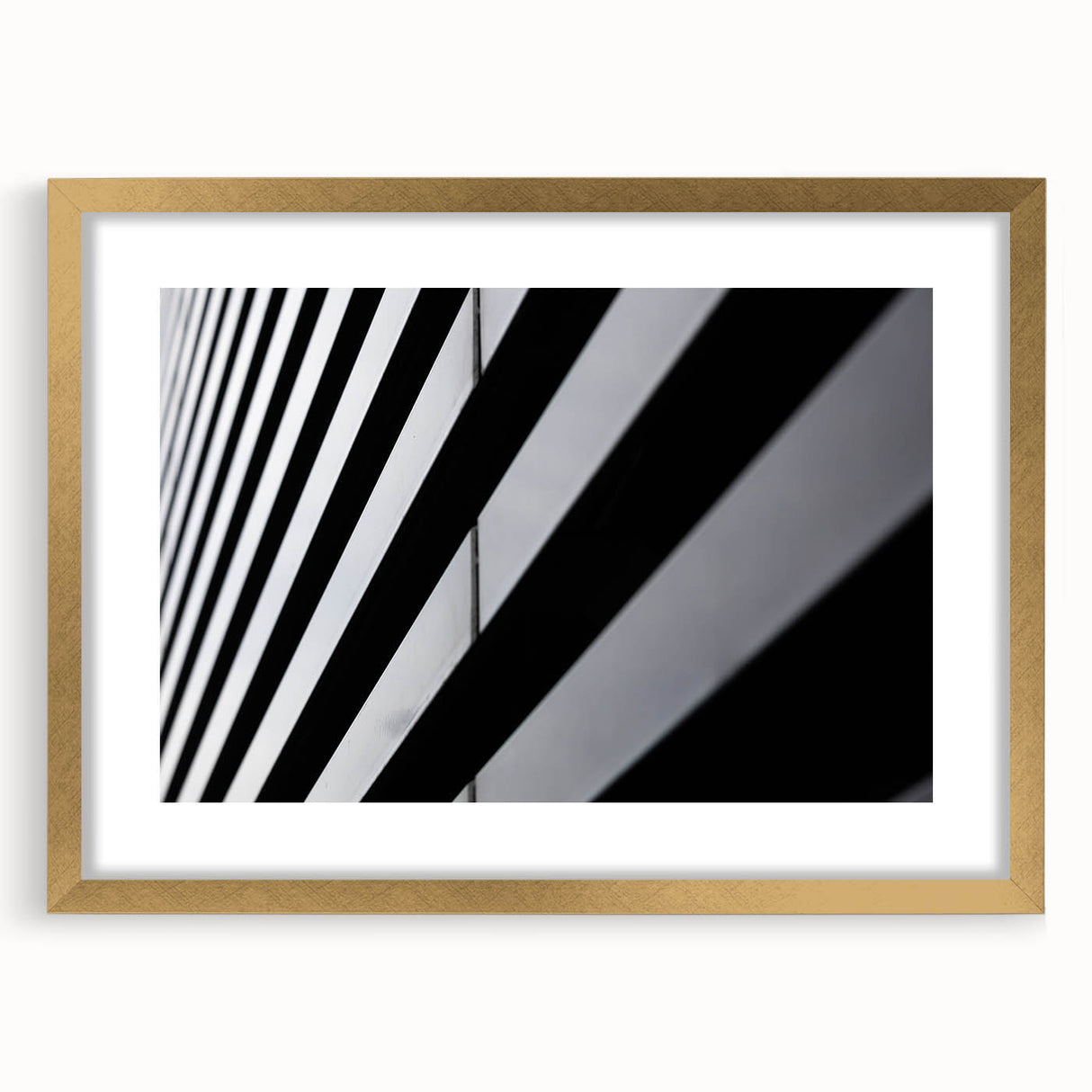 Abstract art print of Amsterdam with muted earth tones in a gold frame, suitable for dining room decor.
