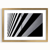 Abstract art print of Amsterdam with muted earth tones in a gold frame, suitable for dining room decor.
