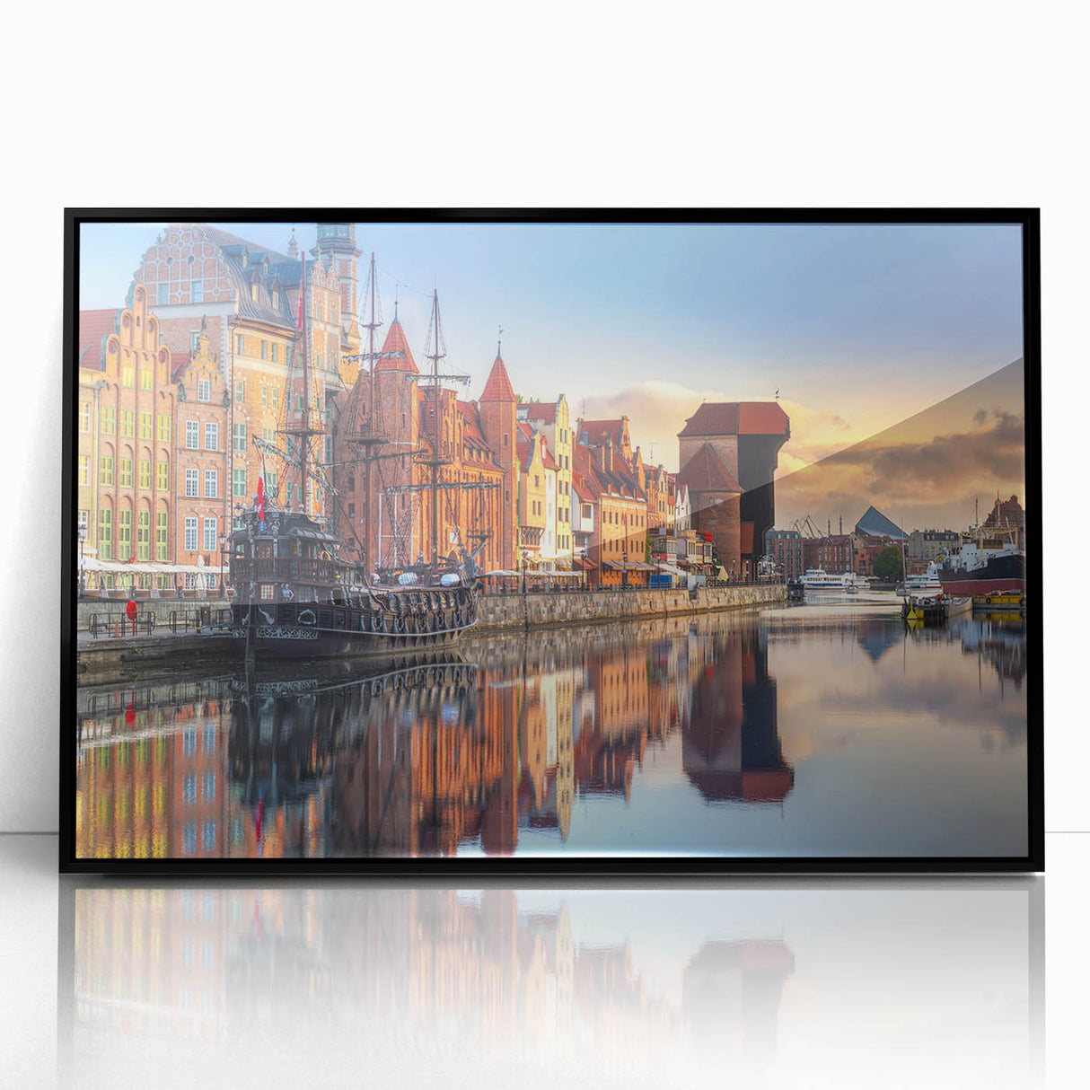 Large abstract wall art depicting a European cityscape in muted gray and blue tones, framed in black acrylic.