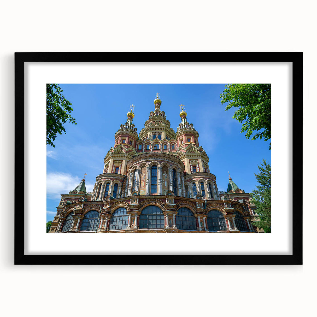 Extra large abstract art print of colorful, textured scene depicting a European cityscape on a framed canvas.