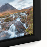 Close-up of a framed canvas depicting a textured Scottish landscape in black with colorful accents.