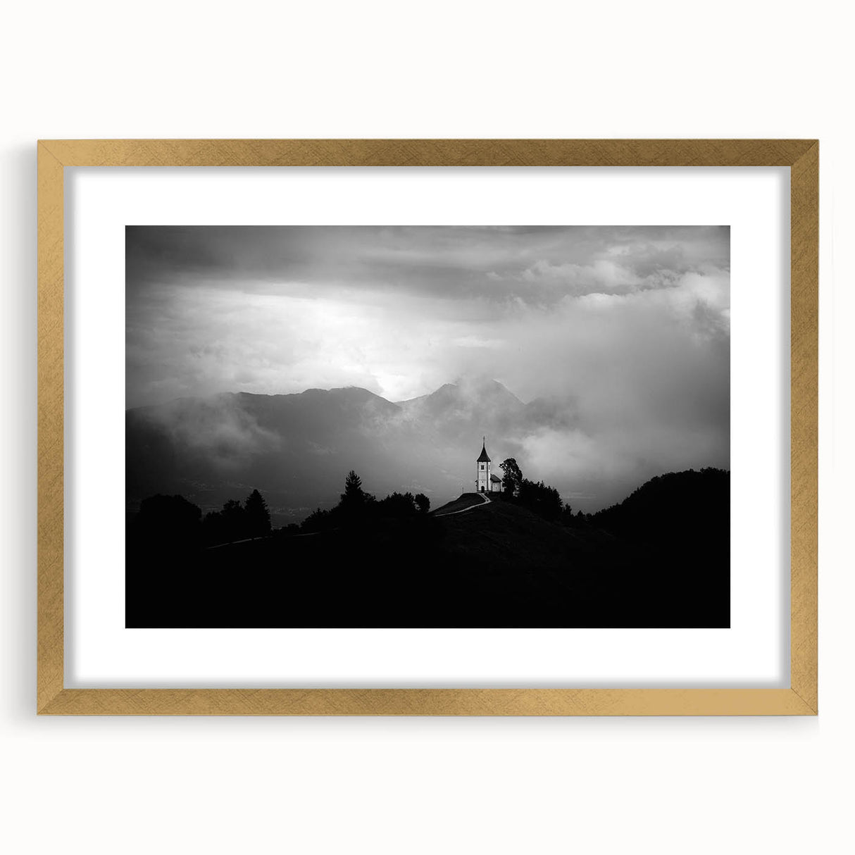 Textured art print of a Slovenian landscape in muted earth tones, framed in gold, ideal for bedroom art.