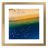 Abstract art print of a European scenery in muted earth tones on a gold-framed canvas, suitable for dining room decor.