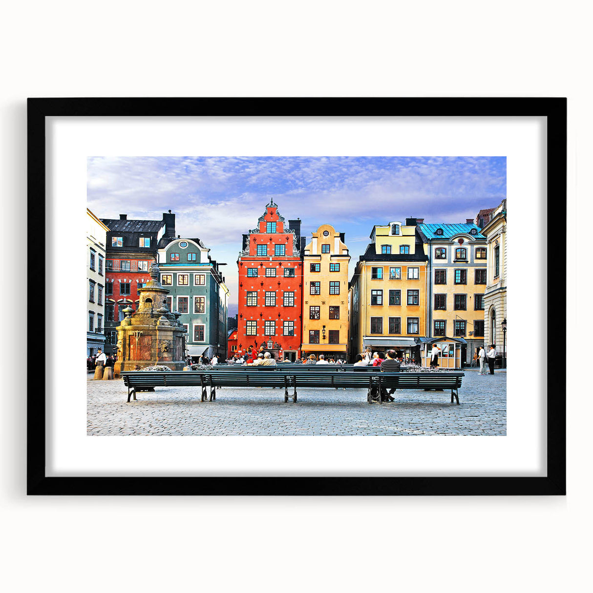 Extra large abstract art print of a vibrant, colorful European scenery on a textured canvas, framed in black.