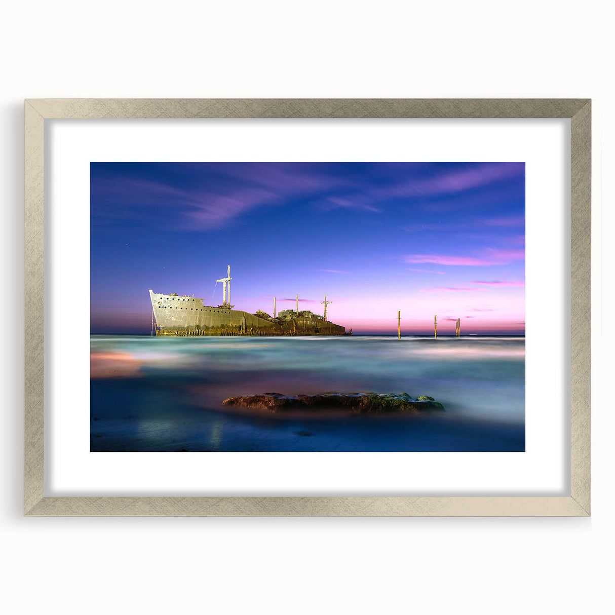 Textured abstract art print depicting a Middle Eastern scenery in muted earth tones, framed with a silver mat.
