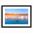 Colorful abstract art print of a Middle Eastern landscape in vibrant hues on a large textured canvas.