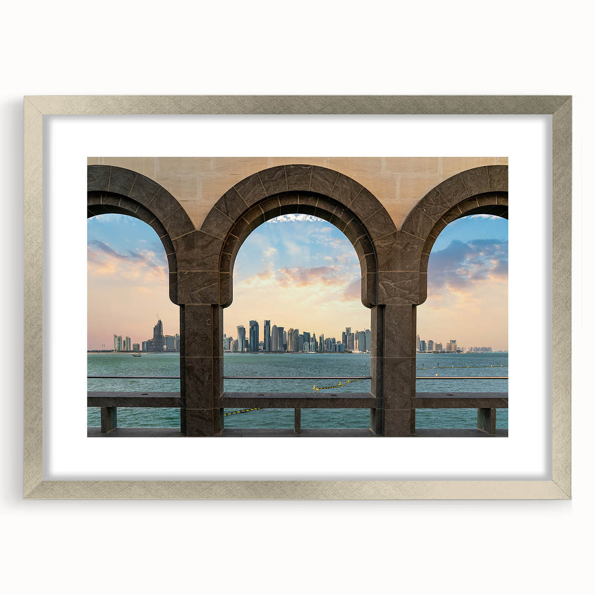 Textured abstract art print of a Middle Eastern scenery in muted earth tones, framed with a silver mat.