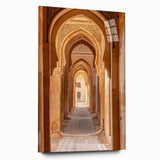 Large abstract wall art featuring a Middle Eastern desert scene in muted earth tones on acrylic glass.