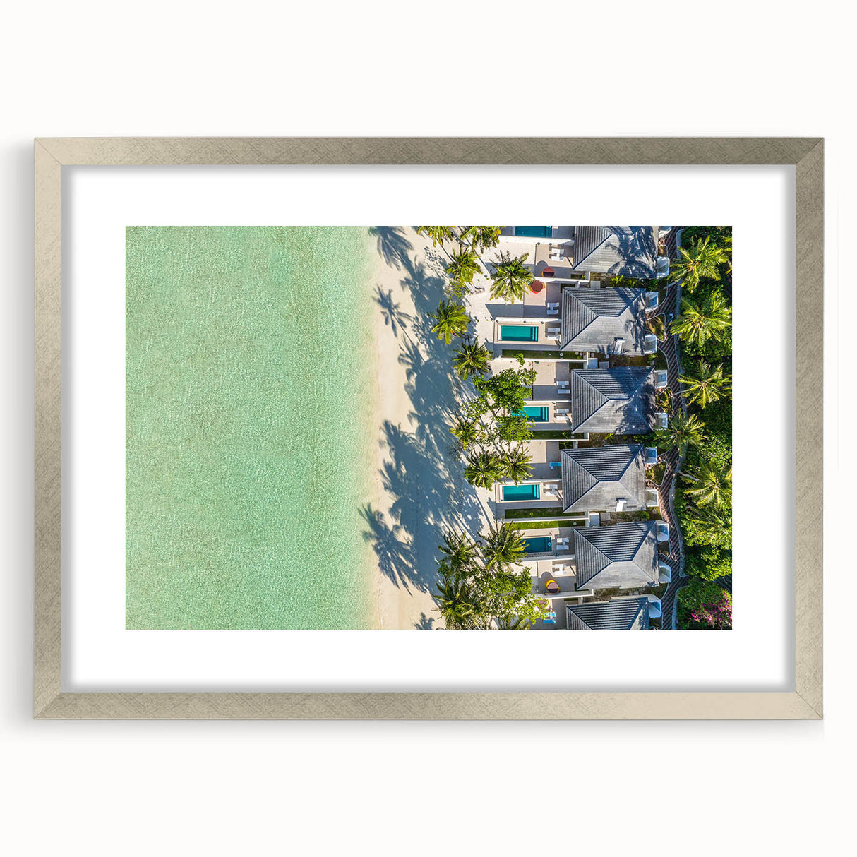 Textured art print of an abstract Tahitian seascape in muted blue and green hues, framed in silver, ideal for bedroom art.