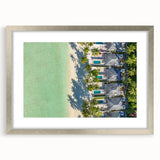 Textured art print of an abstract Tahitian seascape in muted blue and green hues, framed in silver, ideal for bedroom art.